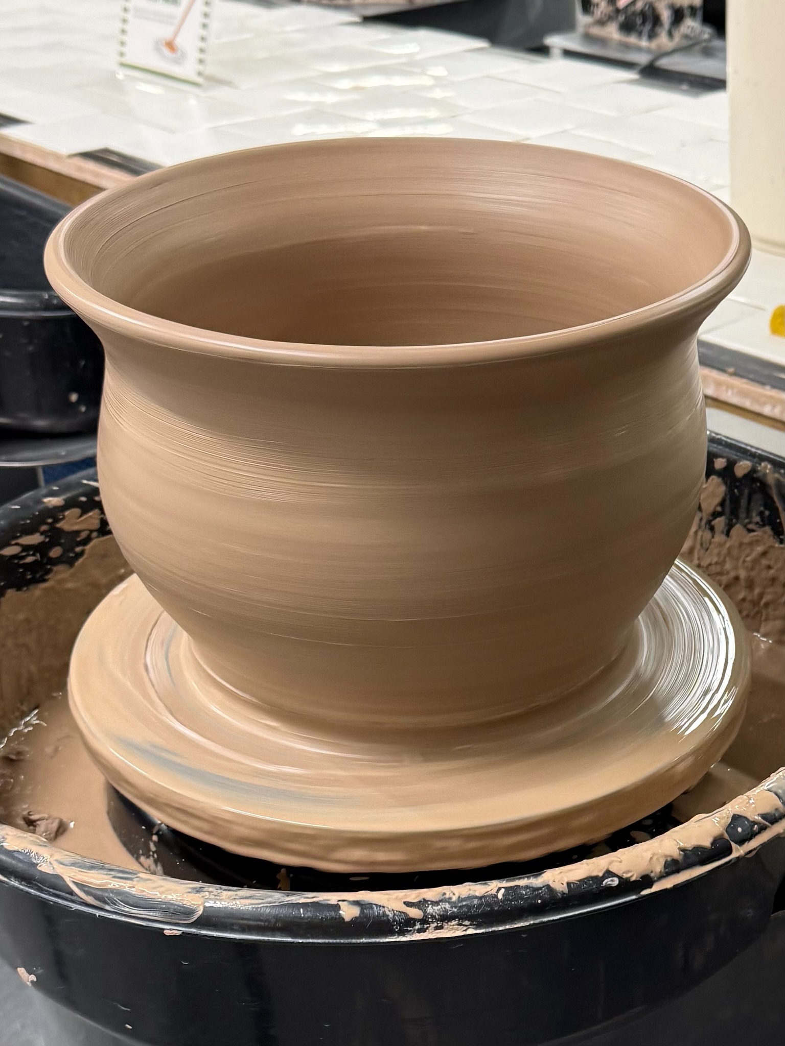 A planter taking shape on the pottery wheel